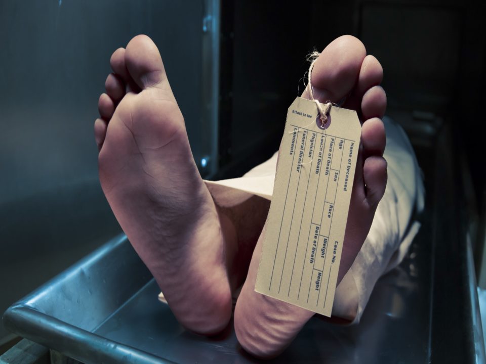 Toe tag on decomposing body