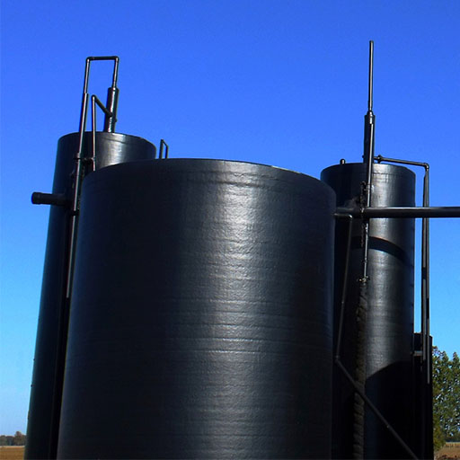Crude Oil Tank pictured, a cylindrical tank roughly 25-50 feet high, black.
